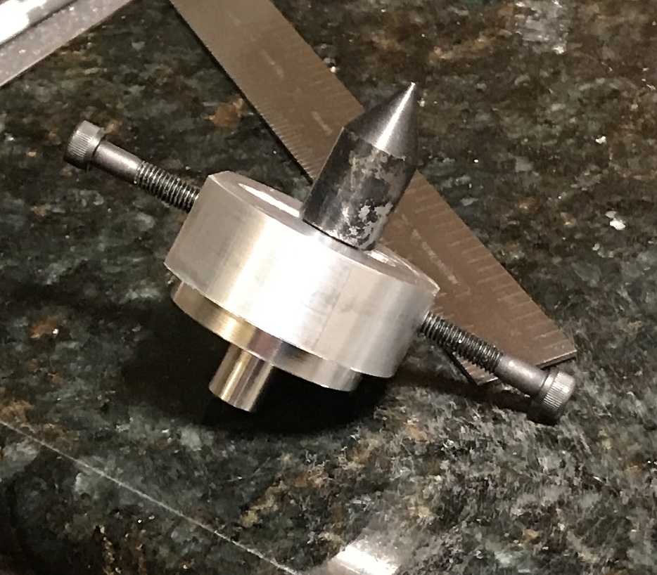 A tailstock offset holding the new center